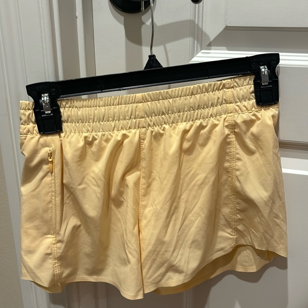 Yellow/orange Athleta shorts. Size:12(girls)